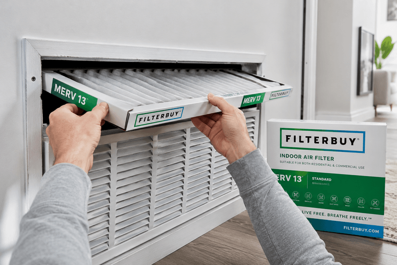 Installing a MERV 13 Filterbuy air filter to protect indoor air during a wildfire smoke event.