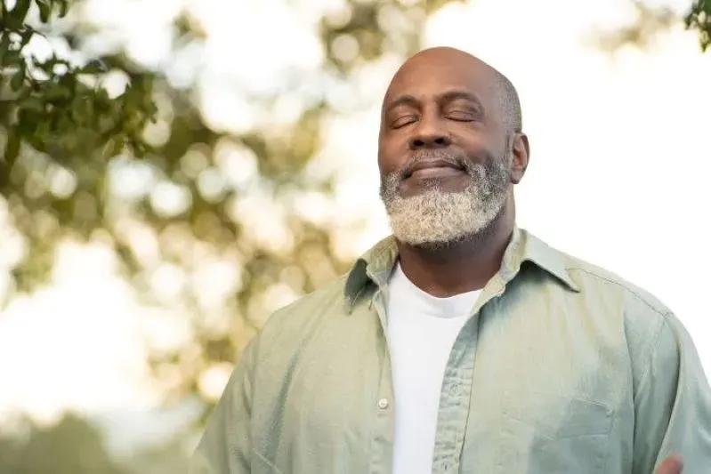 What Happens If You Never Change the Cabin Air Filter - image of a relaxed man enjoying fresh air outdoors.