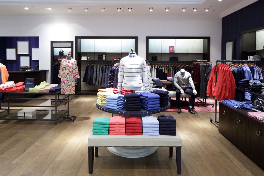 Interior of a retail clothing store with organized apparel displays