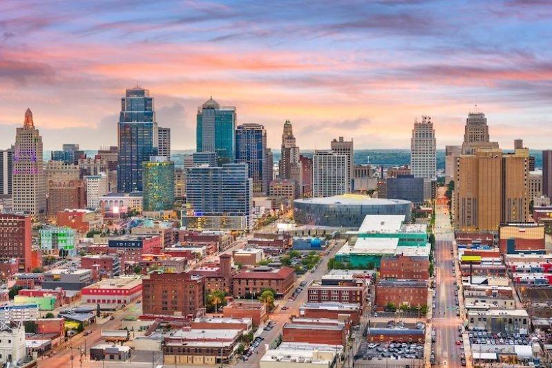 Cities with the Biggest Declines in Air Pollution - Image of a panoramic view of Kansas City at sunset, showcasing tall buildings and the cityscape in the foreground.