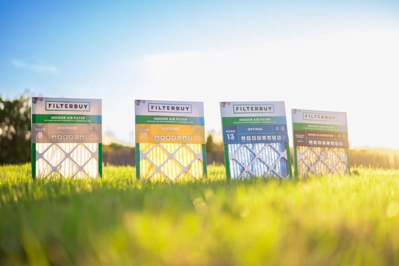 Best Whole Home HVAC System Air Freshener Replacement - Image of four air filters from Filterbuy arranged outdoors on green grass, each labeled with different MERV ratings.