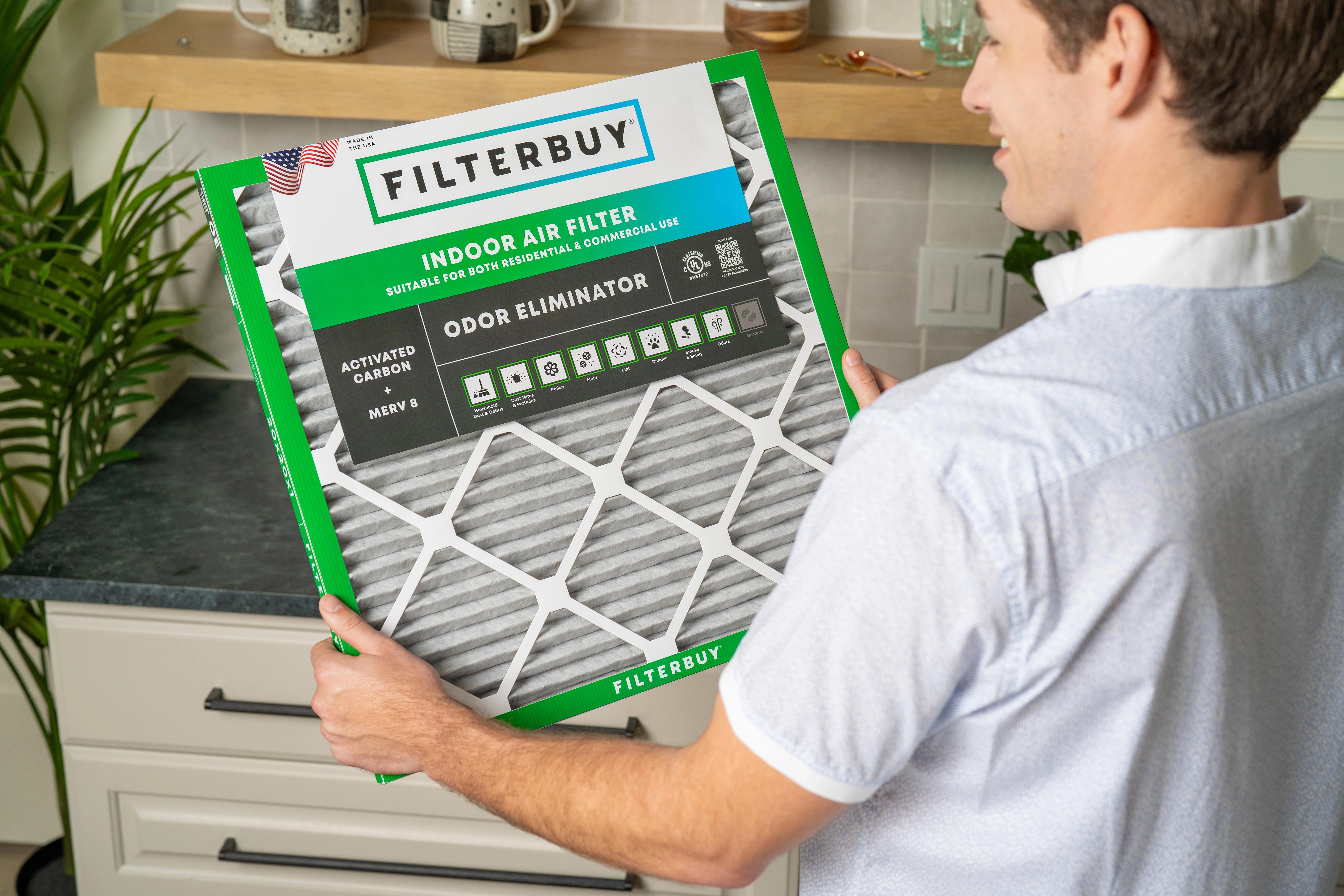 Image of a homeowner who shows he is satisfied with his purchase of an odor eliminator variant of Filterbuy air filters.