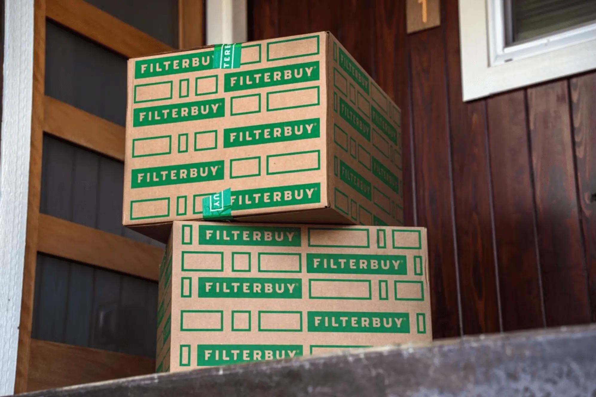 An image of multiple Filterbuy boxes stacked on a front porch, ready for delivery or pickup.