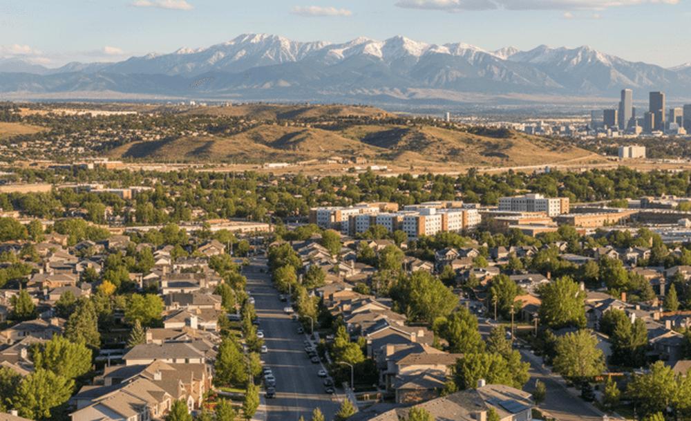 An image of Denver homes with the Rocky Mountains in the background. Check the live air quality index (AQI) map for Denver, Colorado today.