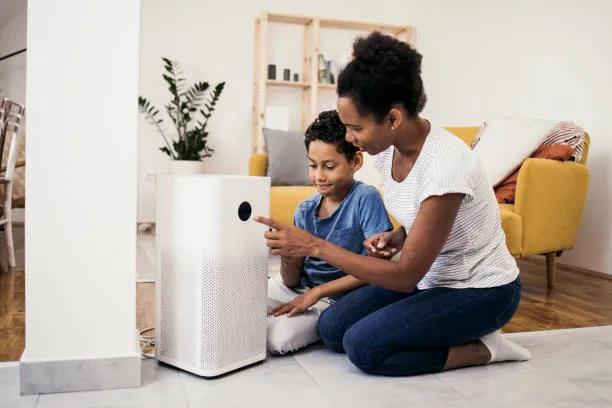 High-Quality Replacement Filters for Your HEPA Air Purifier - image of a satisfied mother and son after using a quality replacement air purifier air filter.