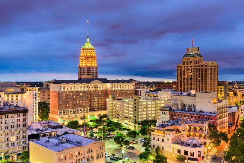 Cityscape at twilight with historic and modern architecture