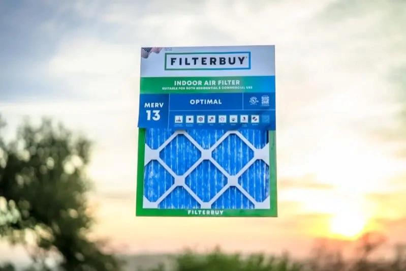 Best Activated Carbon Treatment Filters for Home - Image of MERV 13 indoor air filter with a sunset in the background.