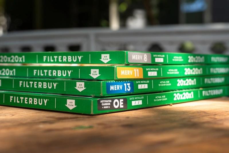 Everything You Need to Know About Foam Air Filter Material for Air Conditioners - Image of a collection of Filterbuy air filters, showcasing different MERV ratings, arranged on a table in a cozy living room setting.