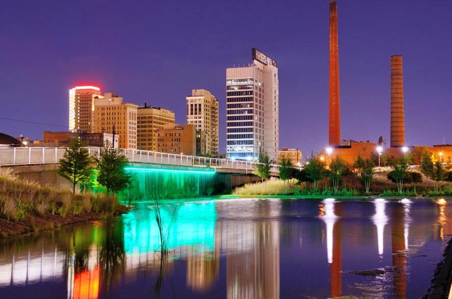 Night view of downtown Birmingham, Alabama — a city known for high energy usage and above-average utility expenses.