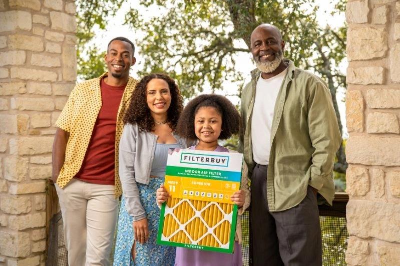What Do Air Diffusers Do & How Does It Work - Image of a happy family smiling as a child holds a filterbuy product.