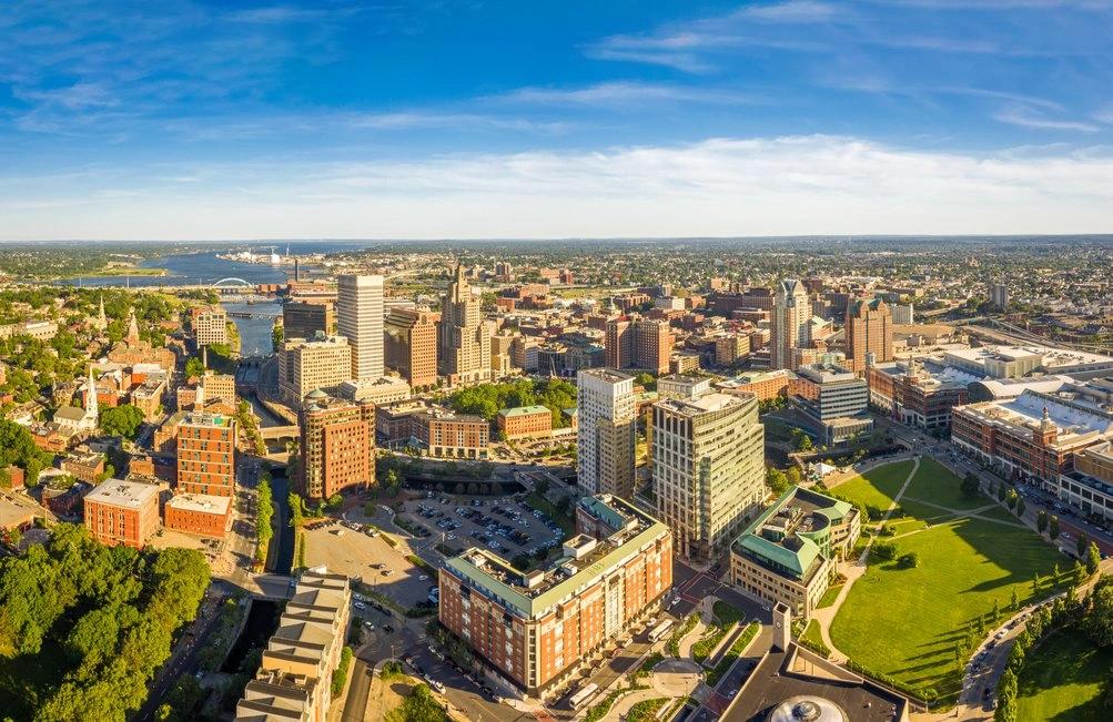 The Hottest City in Every State - Infographics of Aerial view of Providence, Rhode Island, a hottest city in the Ocean State, where urban heat blends with coastal charm during peak summer months.