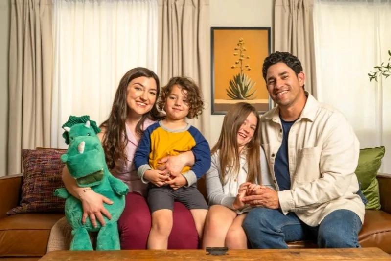 Mesh Air Conditioner Filter Screen Replacement - Image of a Happy family sitting together on a couch, smiling warmly at the camera.