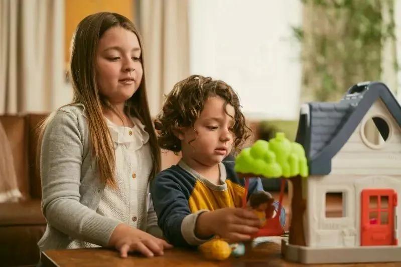 A view of two young children playing indoors in a clean, healthy home environment with filtered air.