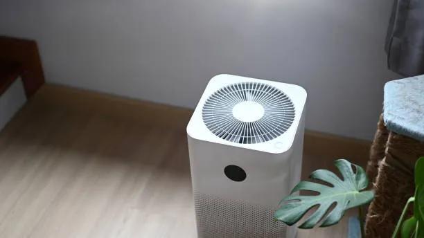 A view of a modern air purifier in a home setting, emphasizing the need for Blueair 211, 411 & 511 air purifier filter replacements for cleaner indoor air.