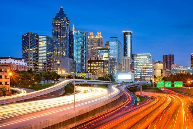 View of Atlanta skyline at dusk with light trails, showcasing a top city prepared for remote work.