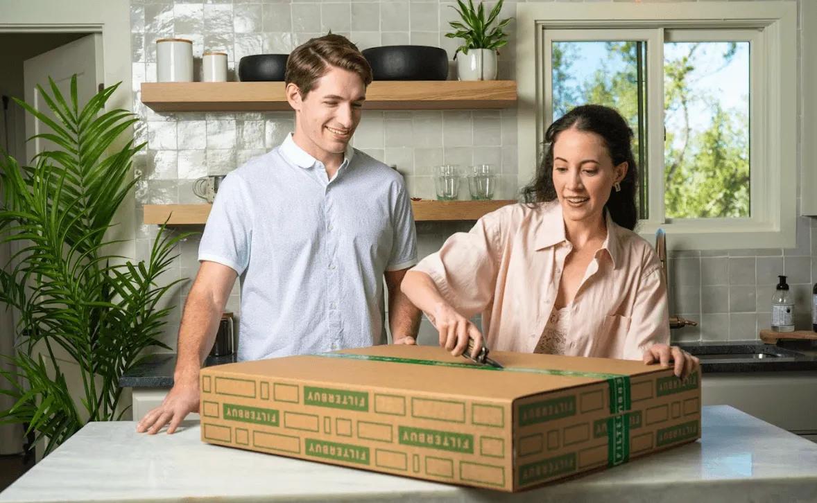 View of a couple unboxing Filterbuy air filters
