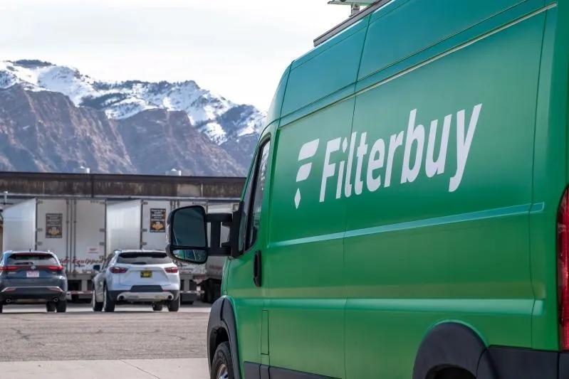 What Happens If You Never Change the Cabin Air Filter - image of a Filterbuy delivery van parked near snow-capped mountains.