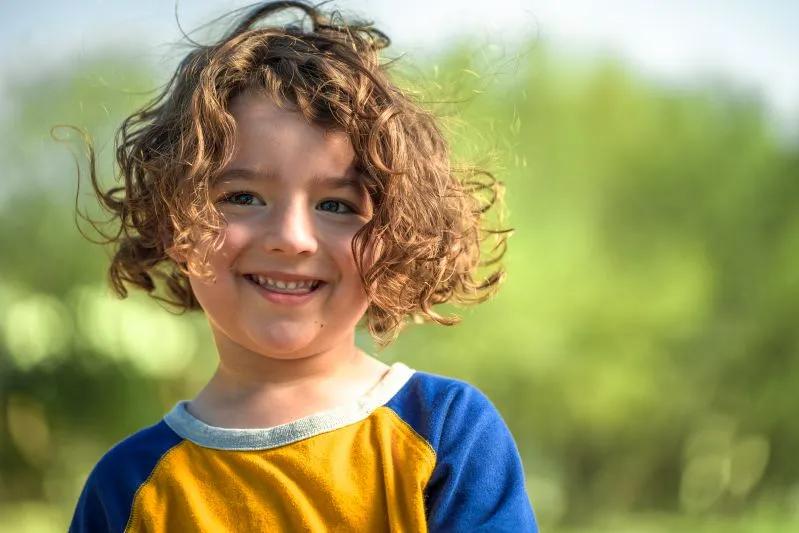 View of a child enjoying the clean air outdoors