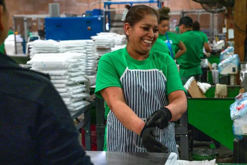 How to Install 23.5x23.5x2 Air Conditioner Filter HEPA - View of female Filterbuy employee organizing air filters