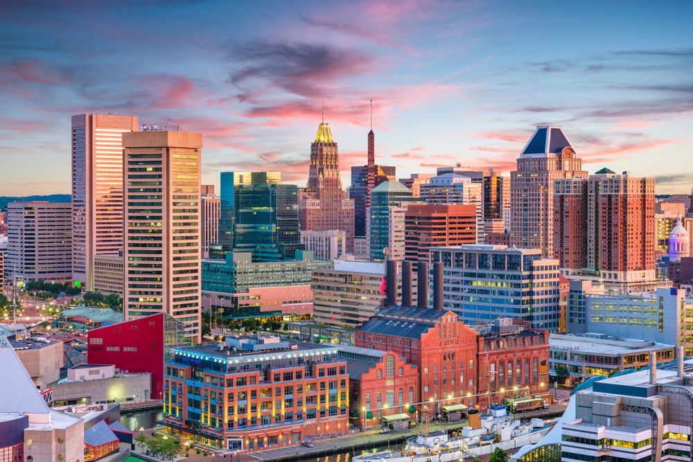 Cities With the Most Residents Who Smoke -Infographics of Skyline of Colorful skyline of Baltimore, Maryland at dusk, a city frequently ranked high in smoking statistics.