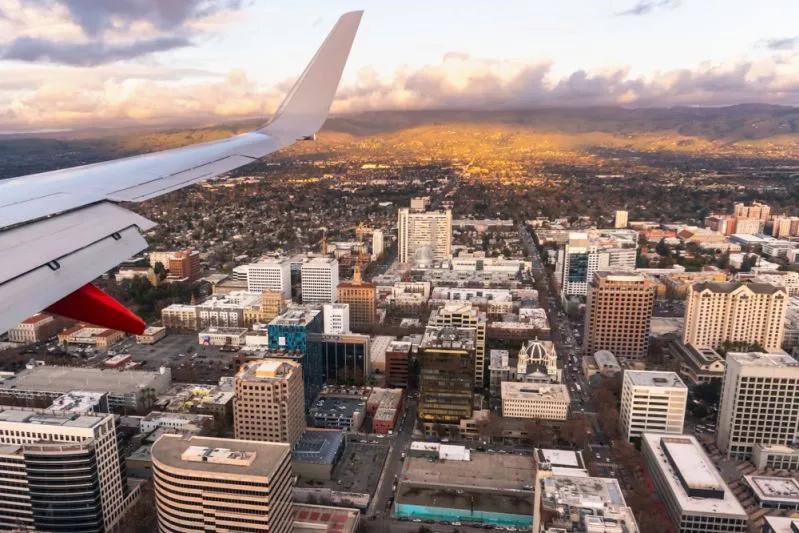 View of San Jose skyline from airplane highlighting Silicon Valley’s severe Millennial renter wage gap.