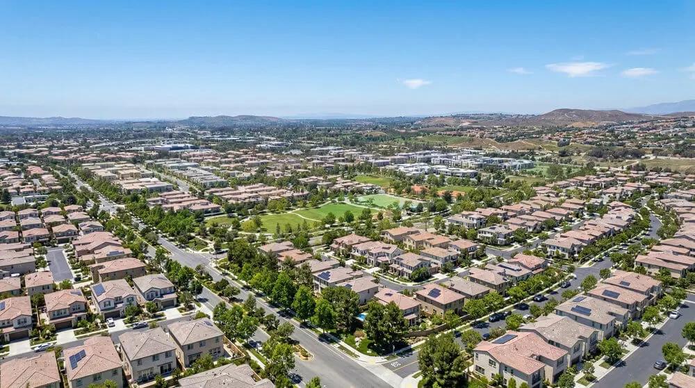 An image of an aerial view over a suburban neighborhood in Irvine, California.