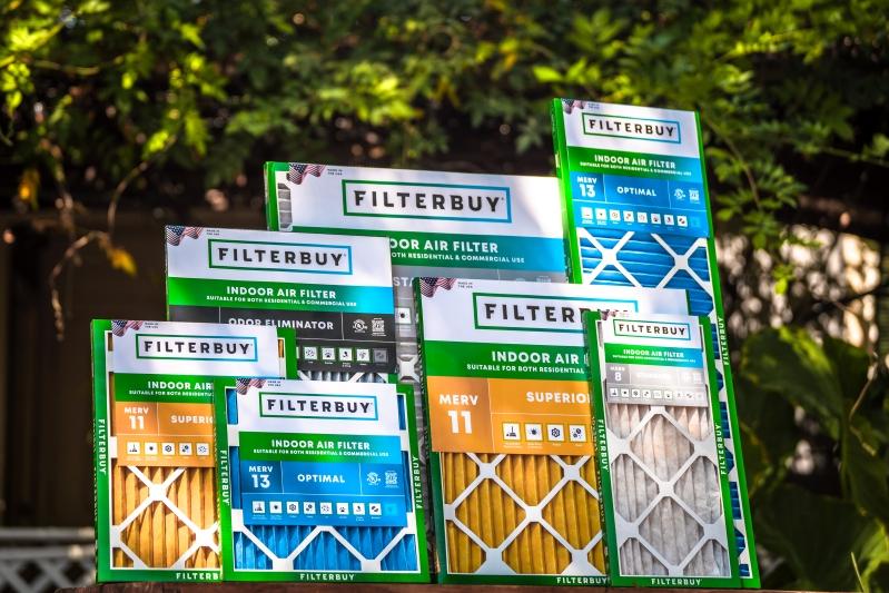 Flanders Company Replacement HVAC Air Filters - Image of various Filterbuy air filters displayed outdoors, showcasing multiple MERV ratings (8, 11, 13) and an odor eliminator option.