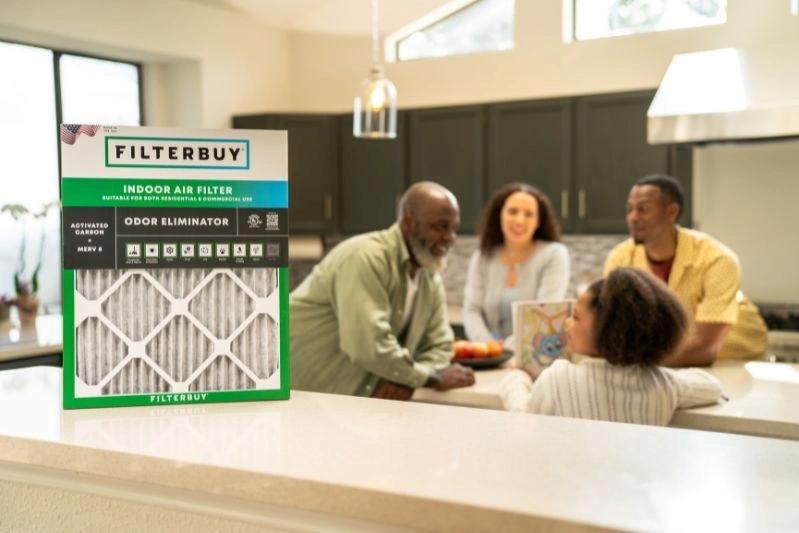 Replacement and How to Fix Oil in Air Filter Paper - Image of Filterbuy Indoor Air Filter with activated carbon, MERV 8 rated, designed to eliminate odors and improve indoor air quality. Family gathers in a bright kitchen, emphasizing clean, fresh air.