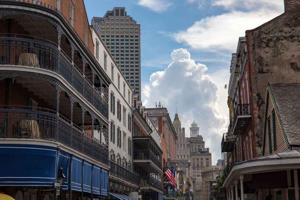 Historic French Quarter buildings in New Orleans with intricate wrought iron balconies.