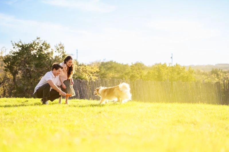 view of man and woman with their dog