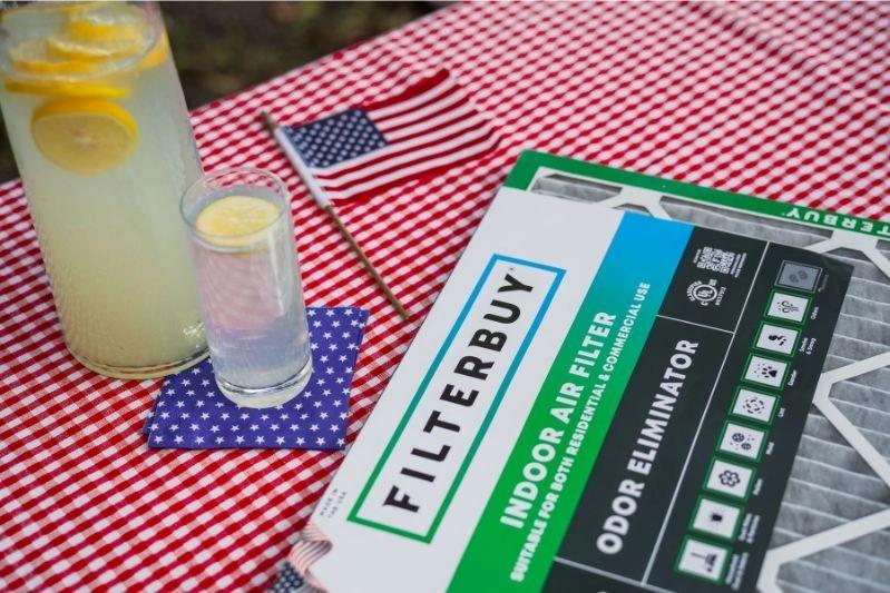 Discount and Custom Made American International Air Filter Replacement - Image of an indoor air filter with a background featuring lemon juice and the USA flag.