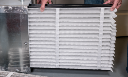 A view of a close-up air filter being installed.