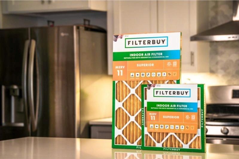 Replacement Factory Direct HVAC Air Filters Near Me - Image of an indoor filter with a MERV 11 rating, displayed in the kitchen. The filter is orange and of superior quality.