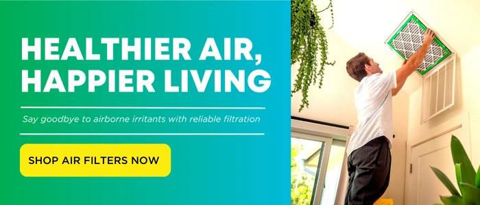 View of a homeowner replacing their HVAC air filter from Filterbuy.