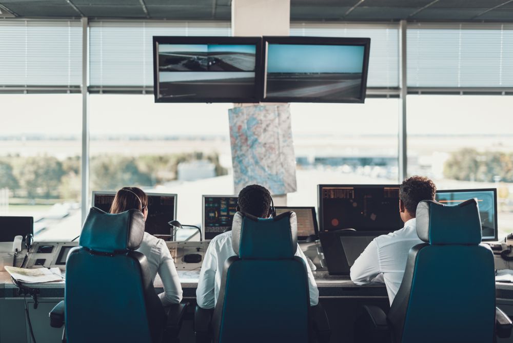 Air traffic controllers working in a control tower