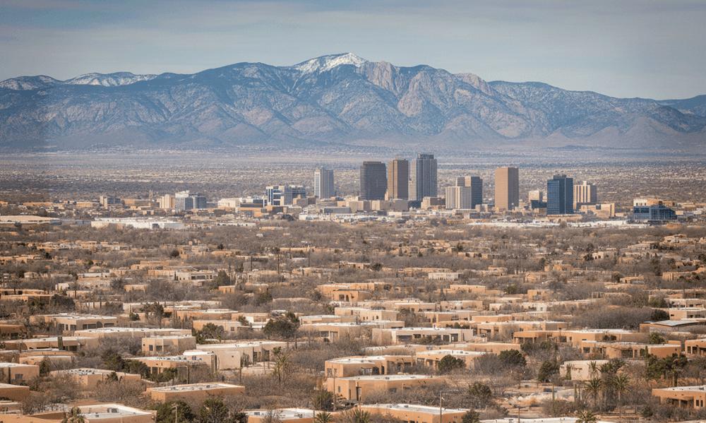 An image of Albuquerque, New Mexico homes with a view of the downtown skyline and Sandia Mountains.