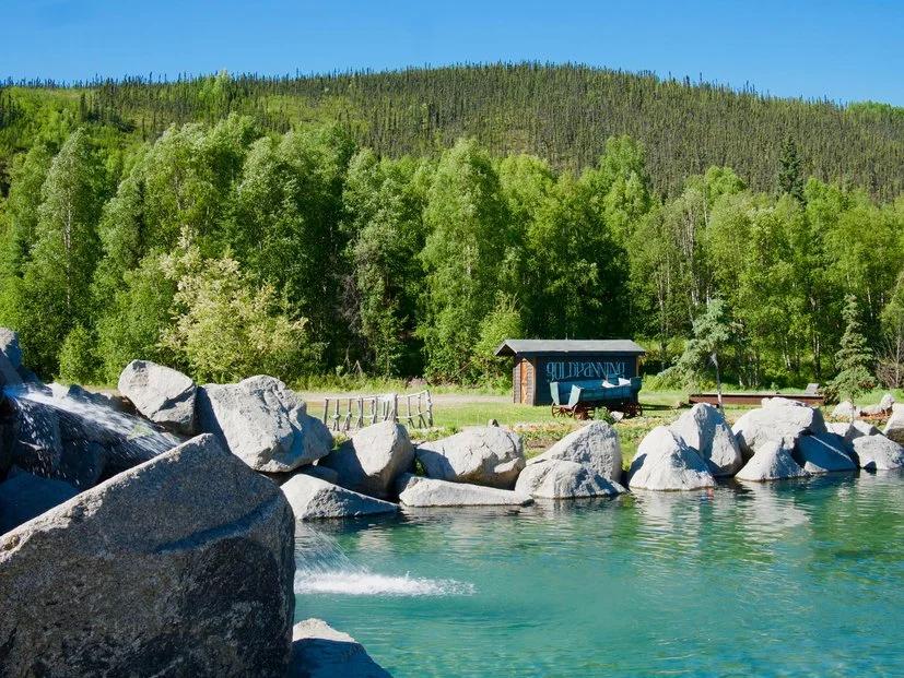 The Hottest City in Every State - Infographics of a rural gold panning site surrounded by forest and water, reflecting life in one of America's remote yet heat-prone locations