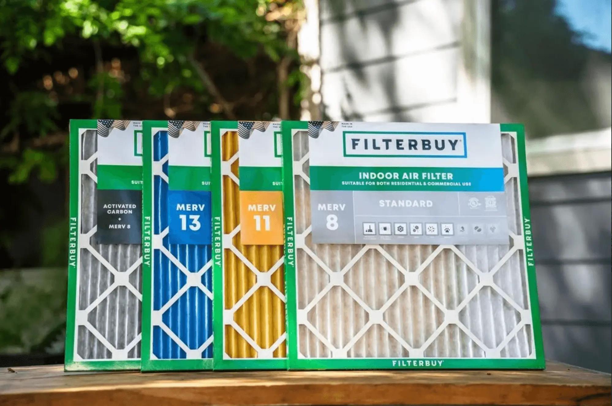 Image of Filterbuy indoor air filters, including MERV 8, 11, and 13, arranged outdoors with packaging visible.