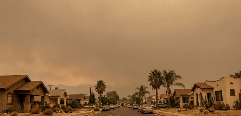 view of the current live wildfire and smoke conditions in Riverside, CA today, showing hazy skies and reduced air quality from nearby fires on a real-time wildfire and smoke map.