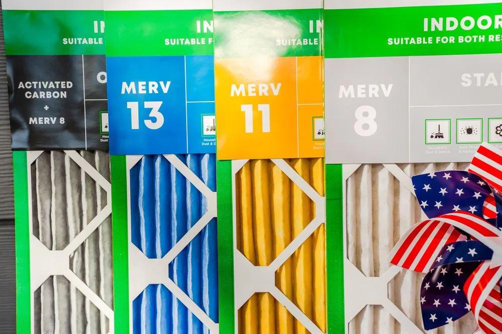 an image of air filters with labels for Activated Carbon + MERV 8, MERV 13, MERV 11, and MERV 8, showcasing different filtration levels.